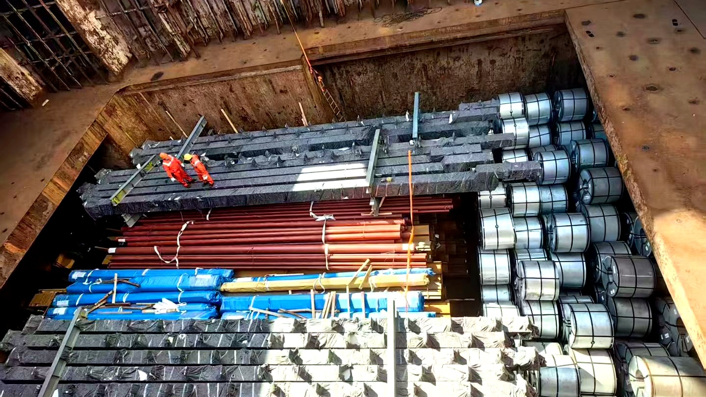 Steel coils, pipes and bundled sections stowed inside a vessel hold