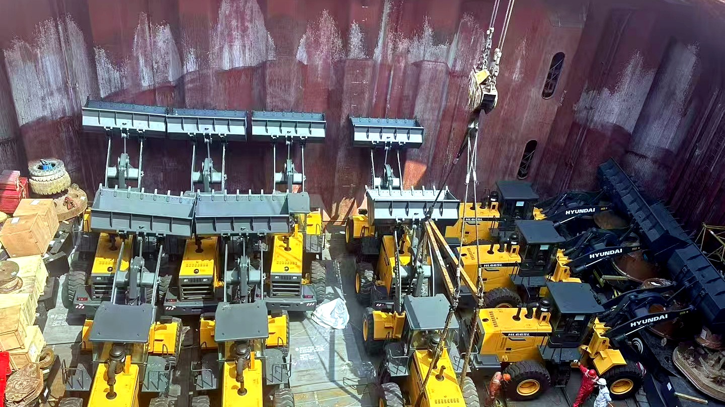Construction machinery loaded inside a vessel hold