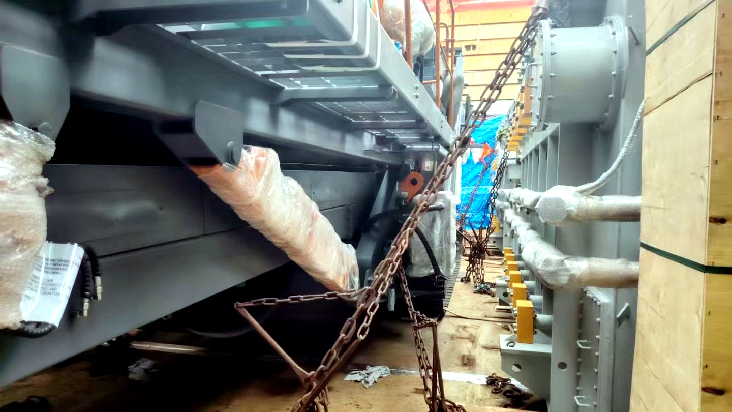 Breakbulk cargo being secured inside a vessel hold