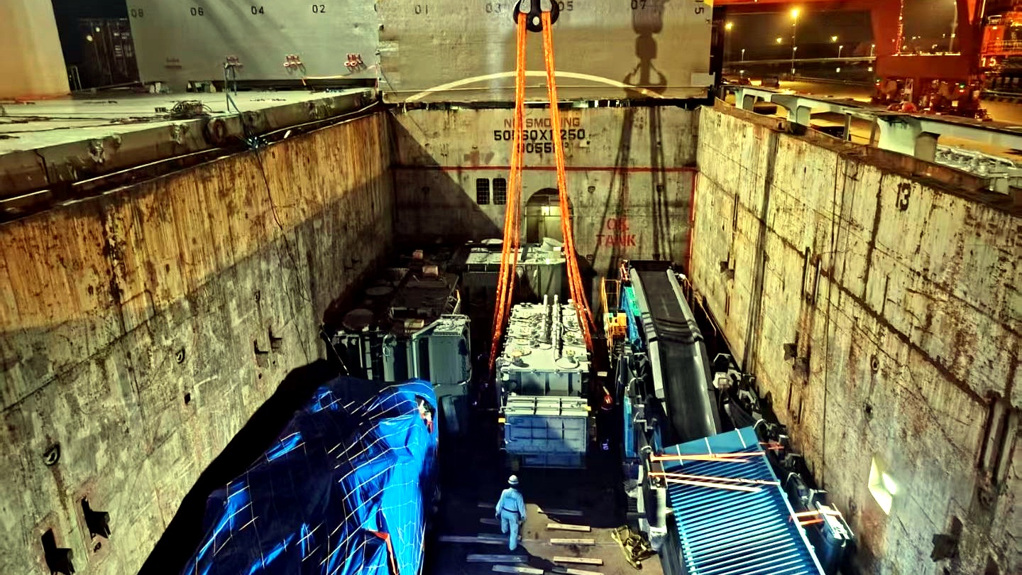 Packaged breakbulk cargo being secured inside a vessel hold